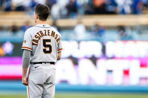 Mike Yastrzemski of the San Francisco Giants looks on during the national anthem prior to Game 4 of the NLDS between the San Francisco Giants and the...