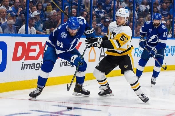 Erik Cernak of the Tampa Bay Lightning skates against Teddy Blueger of the Pittsburgh Penguins during the second period at Amalie Arena on October...