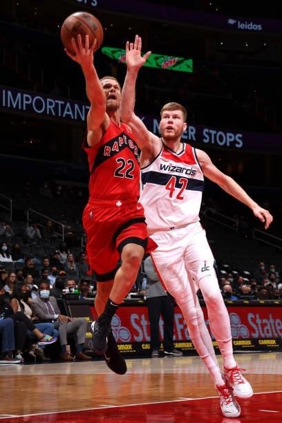 Malachi Flynn of the Toronto Raptors drives to the basket during a preseason game against the Washington Wizards on October 12, 2021 at Capital One...