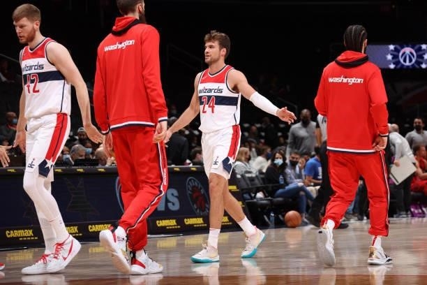 Corey Kispert of the Washington Wizards embraces his teammates during a preseason game against the Toronto Raptors on October 12, 2021 at Capital One...