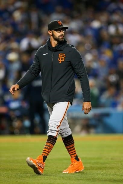 Gabe Kapler of the San Francisco Giants walks to the dugout during Game 4 of the NLDS between the San Francisco Giants and the Los Angeles Dodgers at...