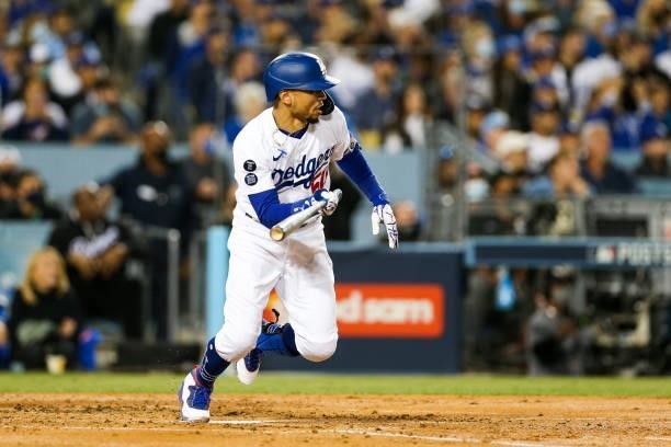 Mookie Betts of the Los Angeles Dodgers singles in the second inning during Game 4 of the NLDS between the San Francisco Giants and the Los Angeles...