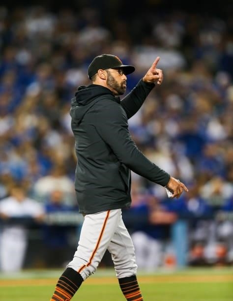 Gabe Kapler of the San Francisco Giants points to the bullpen in the third inning during Game 4 of the NLDS between the San Francisco Giants and the...