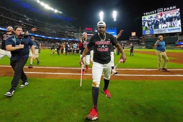 Guillermo Heredia of the Atlanta Braves celebrates after the Braves defeated the Milwaukee Brewers 5-4 in Game 4 of the NLDS between the Milwaukee...