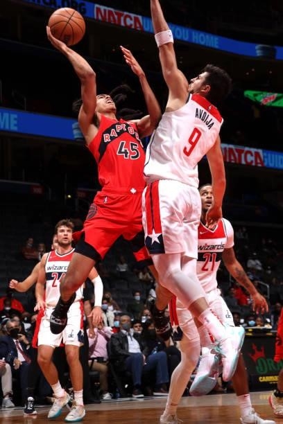 Dalano Banton of the Toronto Raptors drives to the basket during a preseason game against the Washington Wizards on October 12, 2021 at Capital One...
