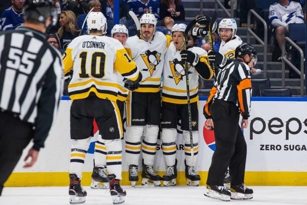 Brian Boyle of the Pittsburgh Penguins celebrates a goal with teammates Sam Lafferty, Marcus Pettersson, and John Marino against the Tampa Bay...
