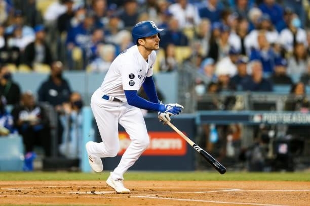 Trea Turner of the Los Angeles Dodgers hits an RBI double in the first inning during Game 4 of the NLDS between the San Francisco Giants and the Los...