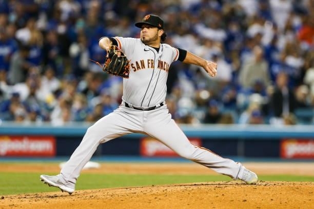 Jose Alvarez of the San Francisco Giants pitches during Game 4 of the NLDS between the San Francisco Giants and the Los Angeles Dodgers at Dodgers...