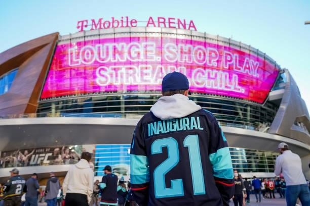 Seattle Kraken fan wearing his team's inaugural jersey walks to the arena prior to NHL action between the Kraken and the Vegas Golden Knights at...