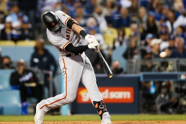 Kris Bryant of the San Francisco Giants hits a single in the second inning during Game 4 of the NLDS between the San Francisco Giants and the Los...