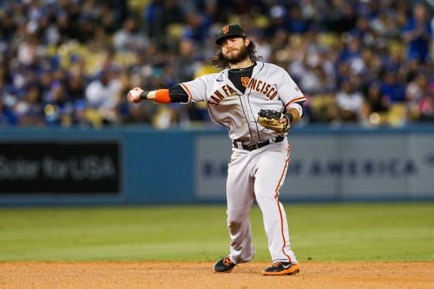 Brandon Crawford of the San Francisco Giants throws to first during Game 4 of the NLDS between the San Francisco Giants and the Los Angeles Dodgers...