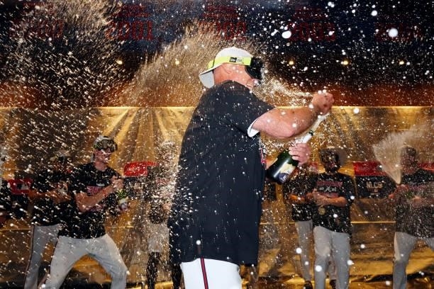 Manager Brian Snitker of the Atlanta Braves celebrates after the Braves defeated the Milwaukee Brewers in Game 4 of the NLDS at Truist Park on...