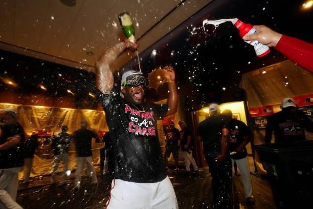 Guillermo Heredia of the Atlanta Braves celebrates after the Braves defeated the Milwaukee Brewers 5-4 in Game 4 of the NLDS at Truist Park on...