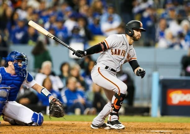 Tommy La Stella of the San Francisco Giants singles in the fifth inning during Game 4 of the NLDS between the San Francisco Giants and the Los...