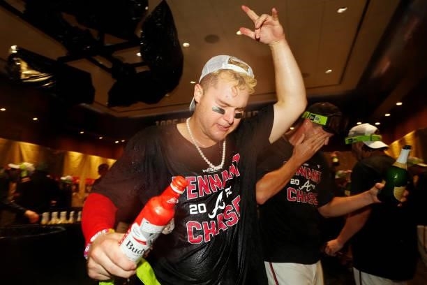 Joc Pederson of the Atlanta Braves celebrates after the Braves defeated the Milwaukee Brewers 5-4 in Game 4 of the NLDS at Truist Park on Tuesday,...