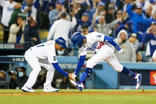 Mookie Betts of the Los Angeles Dodgers rounds the bases after hitting a two-run home run in the fourth inning during Game 4 of the NLDS between the...