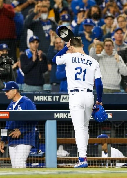 Walker Buehler of the Los Angeles Dodgers walks to the dugout in the fifth inning during Game 4 of the NLDS between the San Francisco Giants and the...