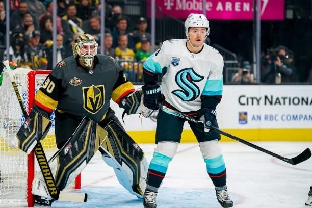 Ryan Donato of the Seattle Kraken and goaltender Robin Lehner of the Vegas Golden Knights keep an eye on the play during first period action at...