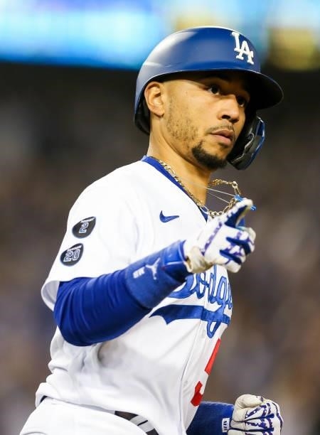 Mookie Betts of the Los Angeles Dodgers reacts after hitting a two run home run in the fourth inning during Game 4 of the NLDS between the San...