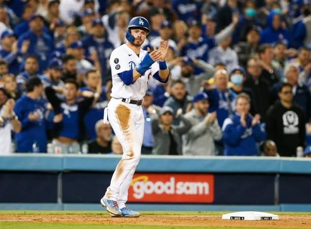 Gavin Lux of the Los Angeles Dodgers reacts after reaching third base in the fifth inning during Game 4 of the NLDS between the San Francisco Giants...
