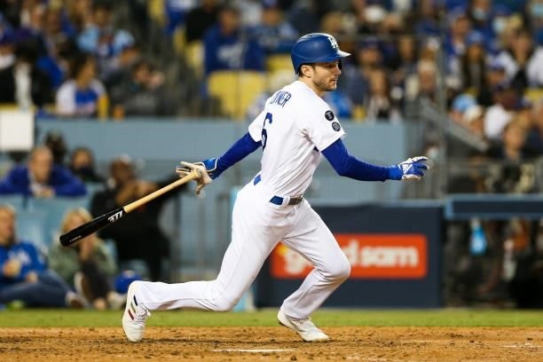 Trea Turner of the Los Angeles Dodgers hits a single in the sixth inning during Game 4 of the NLDS between the San Francisco Giants and the Los...