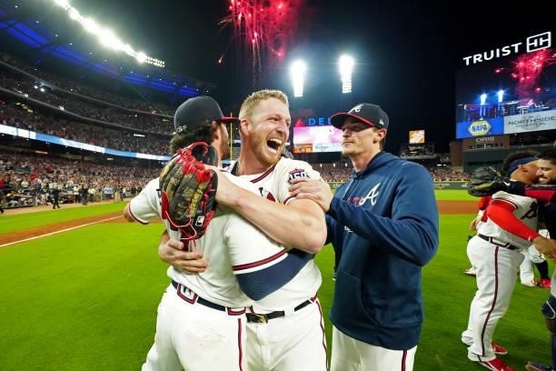 Will Smith of the Atlanta Braves celebrates with teammates after the Braves defeated the Milwaukee Brewers 5-4 in Game 4 of the NLDS at Truist Park...