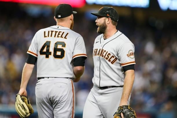 Darin Ruf and Zack Littell of the San Francisco Giants after a Trea Turner of the Los Angeles Dodgers single in the sixth inning during Game 4 of the...