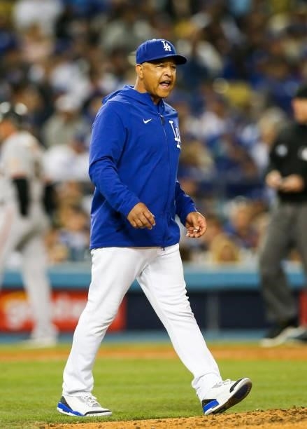 Dave Roberts of the Los Angeles Dodgers walks to the mound in the seventh inning during Game 4 of the NLDS between the San Francisco Giants and the...