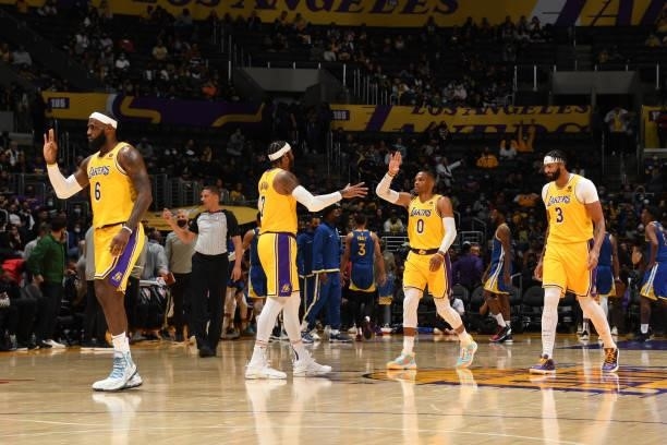 LeBron James, Carmelo Anthony, Russell Westbrook and Anthony Davis of the Los Angeles Lakers high five during a preseason game against the Golden...