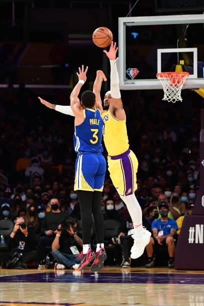 Carmelo Anthony of the Los Angeles Lakers reaches to attempt to block a shot by Jordan Poole of the Golden State Warriors during a preseason game on...