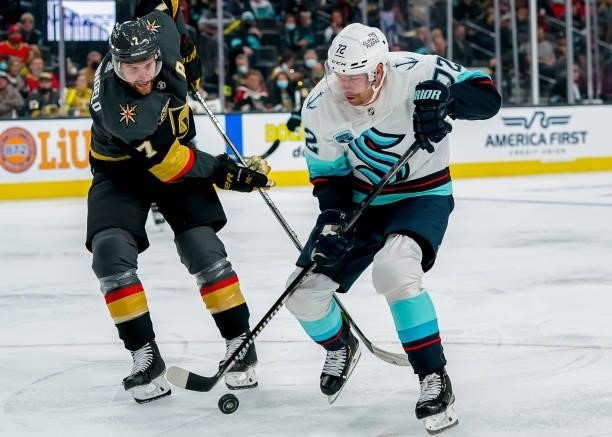 Joonas Donskoi of the Seattle Kraken plays the puck away from Alex Pietrangelo of the Vegas Golden Knights during third period action at T-Mobile...