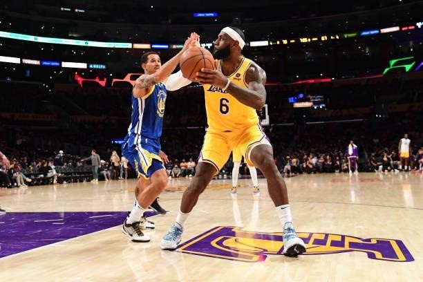 LeBron James of the Los Angeles Lakers handles the ball during a preseason game against the Golden State Warriors on October 12, 2021 at STAPLES...
