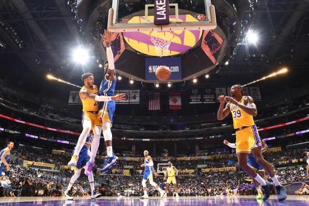 Trevelin Queen of the Los Angeles Lakers passes the ball to Dwight Howard of the Los Angeles Lakers during a preseason game against the Golden State...