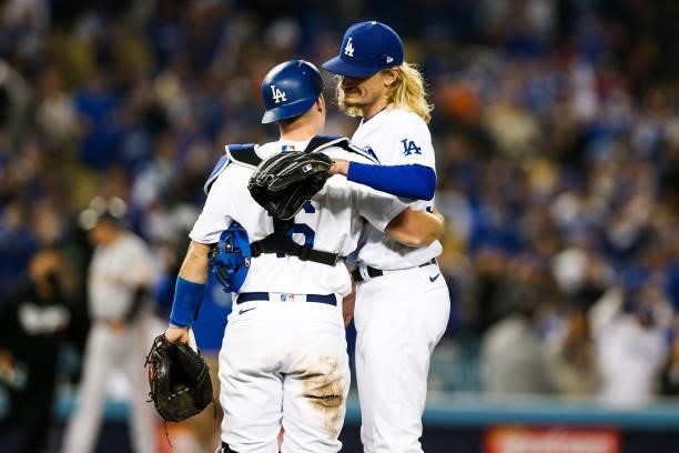 Phil Bickford of and Will Smith of the Los Angeles Dodgers hug after the final out of Game 4 of the NLDS between the San Francisco Giants and the Los...