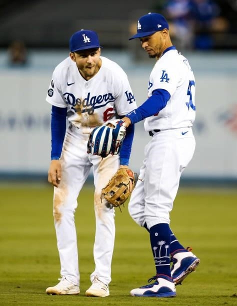 Trea Turner looks a the glove of t Mookie Betts of the Los Angeles Dodgers during Game 4 of the NLDS between the San Francisco Giants and the Los...