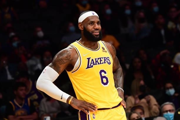 LeBron James of the Los Angeles Lakers smiles during a preseason game against the Golden State Warriors on October 12, 2021 at STAPLES Center in Los...