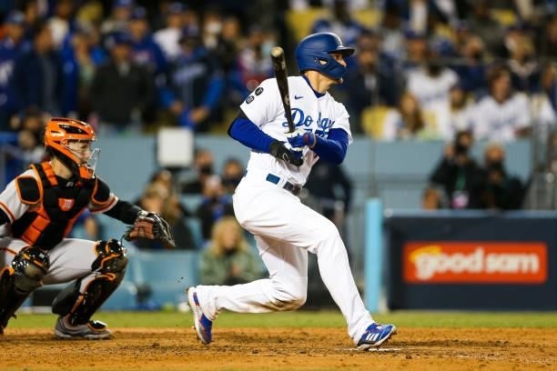 Corey Seager of the Los Angeles Dodgers singles in the eighth inning during Game 4 of the NLDS between the San Francisco Giants and the Los Angeles...