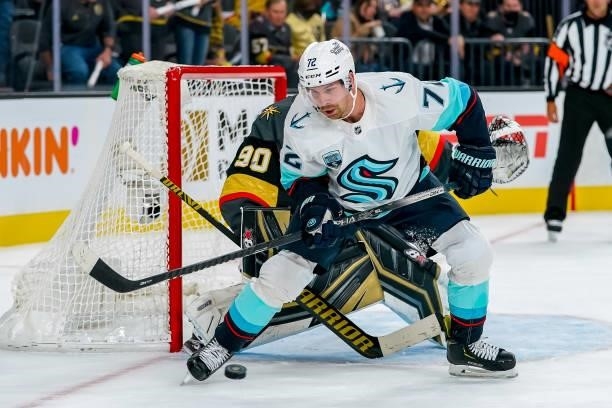 Joonas Donskoi of the Seattle Kraken keeps an eye on the puck in front of goaltender Robin Lehner of the Vegas Golden Knights during second period...