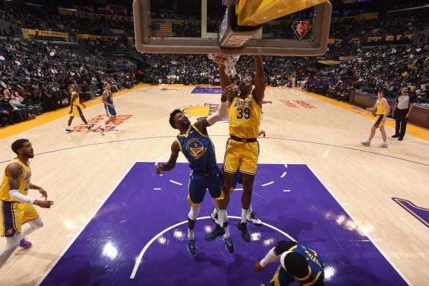 Dwight Howard of the Los Angeles Lakers dunks the ball during a preseason game against the Golden State Warriors on October 12, 2021 at STAPLES...