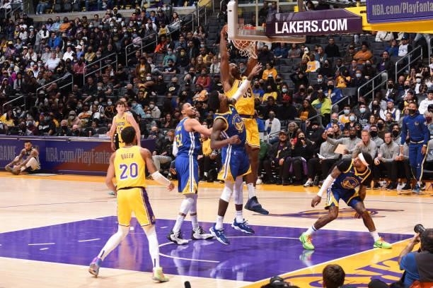 Dwight Howard of the Los Angeles Lakers dunks the ball during a preseason game against the Golden State Warriors on October 12, 2021 at STAPLES...