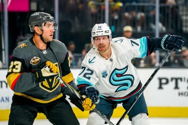 Alec Martinez of the Vegas Golden Knights and Joonas Donskoi of the Seattle Kraken battle for position during first period action at T-Mobile Arena...