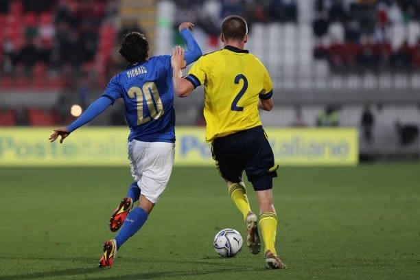 Emanuel Vignato of U21 Italy fights for the ball against Emil Holm of U21 Sweden during the UEFA European Under-21 Championship Qualifier football...