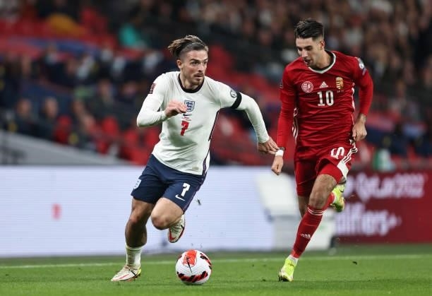 Jack Grealish of England in action with Dominik Szoboszlai of Hungary during the 2022 FIFA World Cup Qualifier match between England and Hungary at...