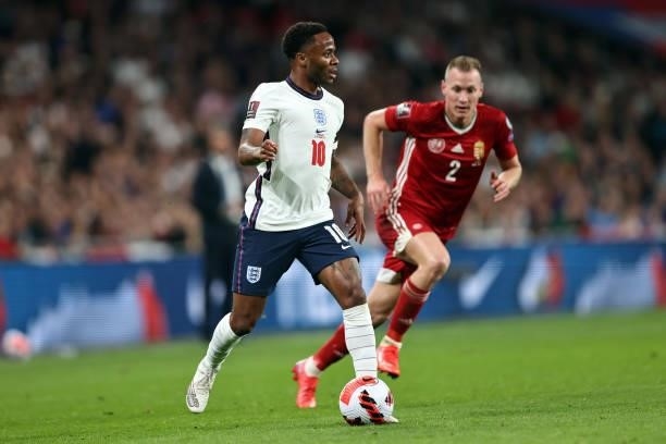 Raheem Sterling of England in action with Adam Lang of Hungary during the 2022 FIFA World Cup Qualifier match between England and Hungary at Wembley...