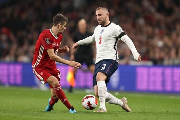 Luke Shaw of England in action with Adam Nagy of Hungary during the 2022 FIFA World Cup Qualifier match between England and Hungary at Wembley...