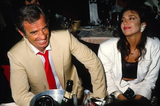 Actor Jean Paul Belmondo and Carlos Sotto Mayor attend a Cocktail Party at the Lido on 1986, in Paris, France.