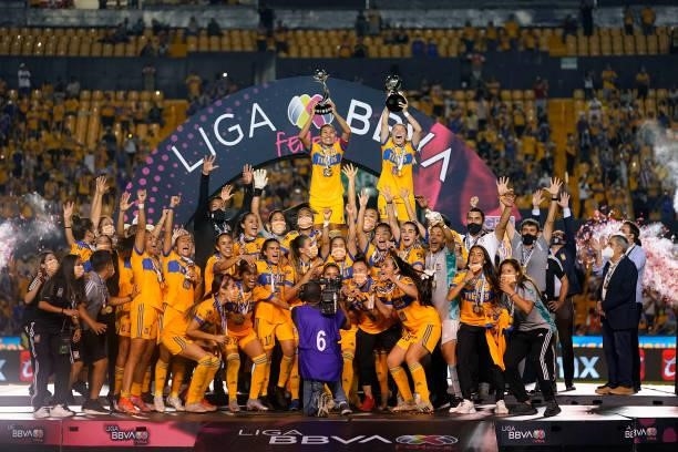 Players of Tigres celebrate with the champion trophy after winning the Final second leg match between Tigres UANL and Chivas as part of the Torneo...