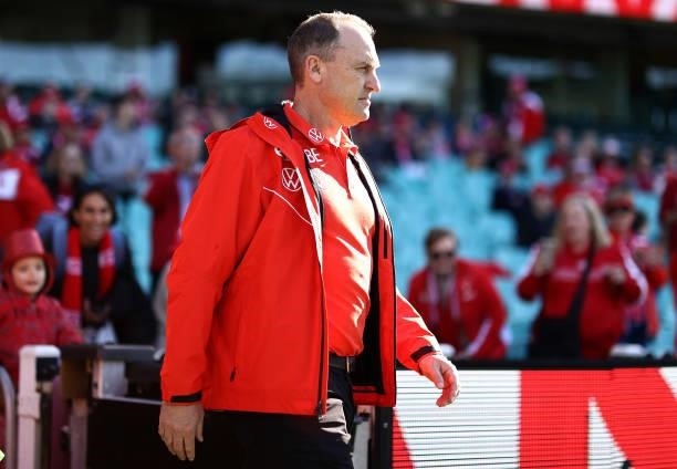 Swans head coach John Longmire walks out onto the field during the round 12 AFL match between the St Kilda Saints and the Sydney Swans at Sydney...