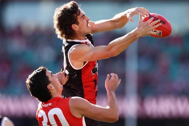 Max King of the Saints marks infront of Tom McCartin of the Swans during the round 12 AFL match between the St Kilda Saints and the Sydney Swans at...