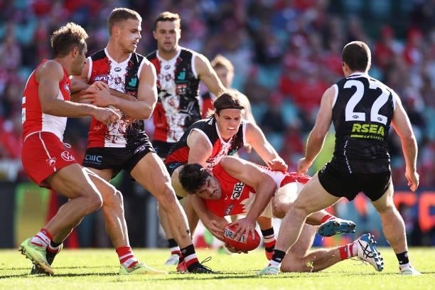 George Hewett of the Swans is tackled by Jarryn Geary of the Saints during the round 12 AFL match between the St Kilda Saints and the Sydney Swans at...